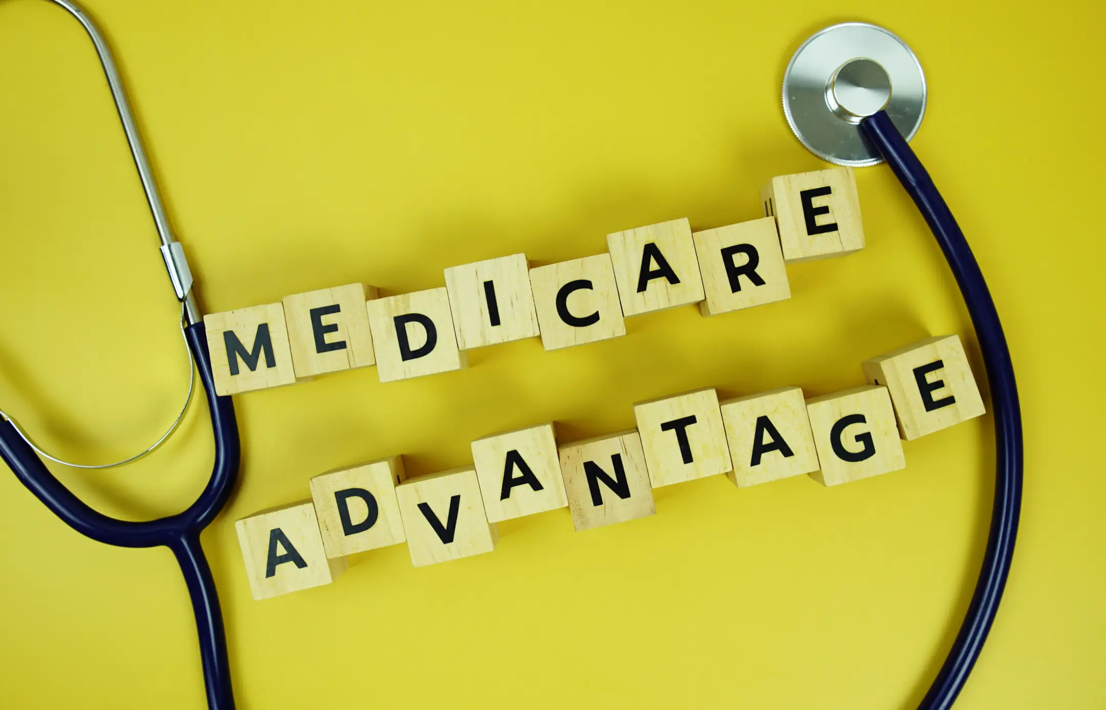 Stethoscope and blocks spelling Medicare Advantage