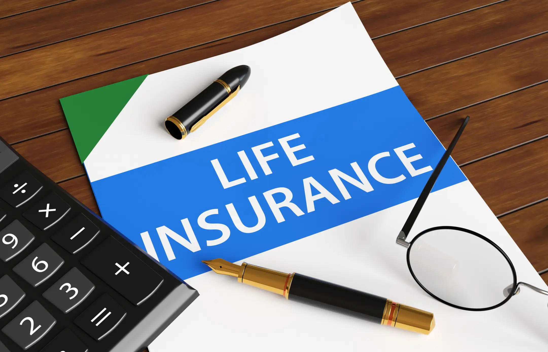Life insurance document with pen and calculator